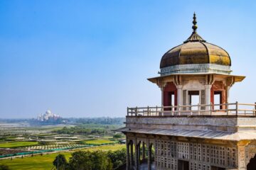 photo of a tower with a view of the taj mahal agra india