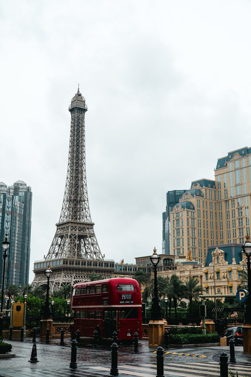iconic eiffel tower in macau with red bus